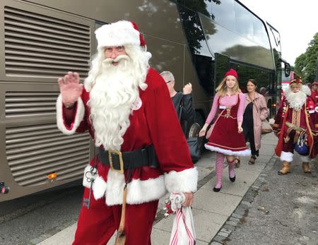 People dressed as Santa Claus take take part in the World Santa Claus Congress, an annual event held every summer in Copenhagen, Denmark, July 25, 2017. REUTERS/Stine Jacobsen