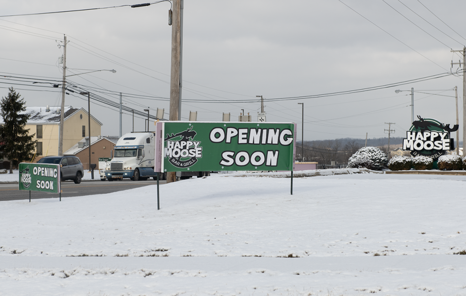 A sign in from of the Happy Moose on state Route 14 says the restaurant will be "opening soon" after being closed since a fire last year.