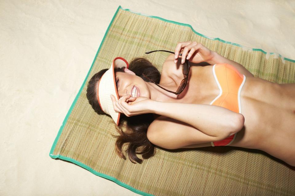 woman on the beach in bikini smiling