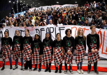 Children attend a Global Campaign to Demand Climate Justice demonstration before the final session of the COP24 U.N. Climate Change Conference 2018 in Katowice, Poland, December 14, 2018. REUTERS/Kacper Pempel