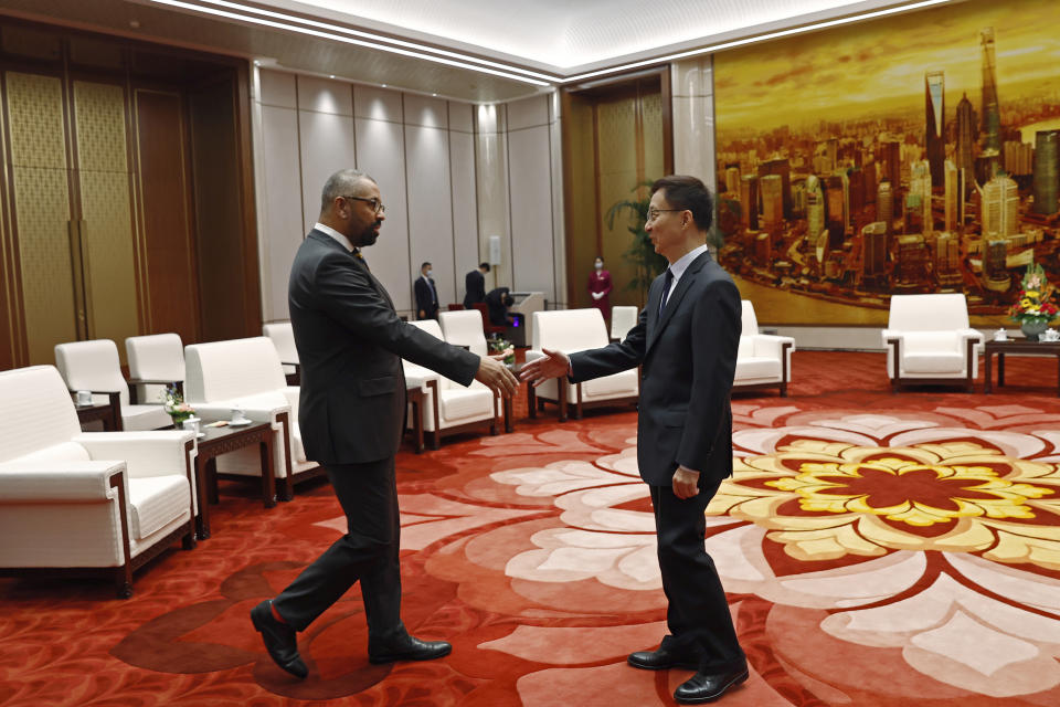 British Foreign Secretary James Cleverly, left, and Chinese Vice President Han Zheng shake hands before a meeting at the Great Hall of the People in Beijing, China Wednesday, Aug. 30, 2023. (Florence Lo/Pool Photo via AP)