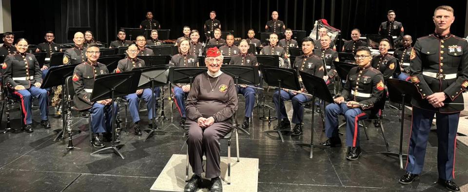 Mildred "Millie" Cox with the Parris Island Marine Band when it visited North Quincy High School on March 12, 2024, on an entertainment and recruiting tour. Christine Cugini, Quincy's director of veterans services, escorted Cox to the event.