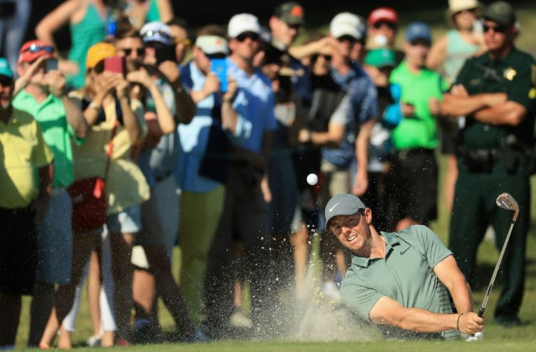 Rory McIlroy blasted out of a bunker to two feet to birdie the par-5 fourth and sank a 12-foot birdie putt at nine to surge into the title hunt at the Arnold Palmer Invitational