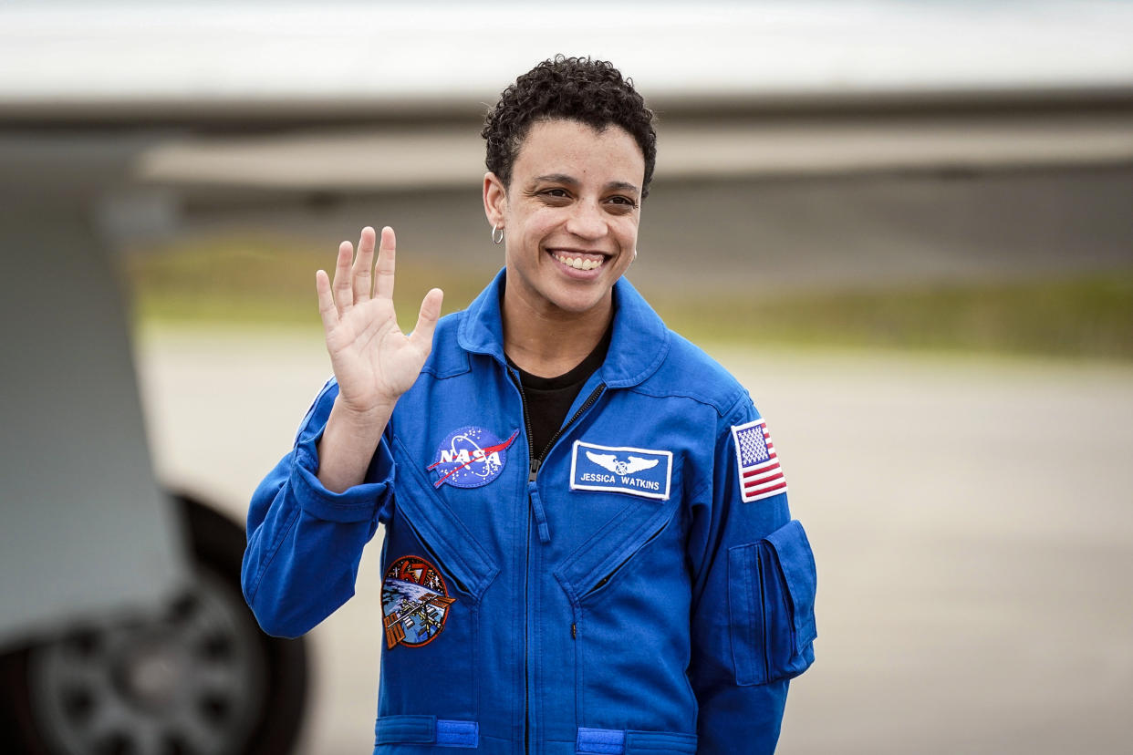 Image: NASA astronaut, mission specialist, Jessica Watkins waves as she arrives with 
