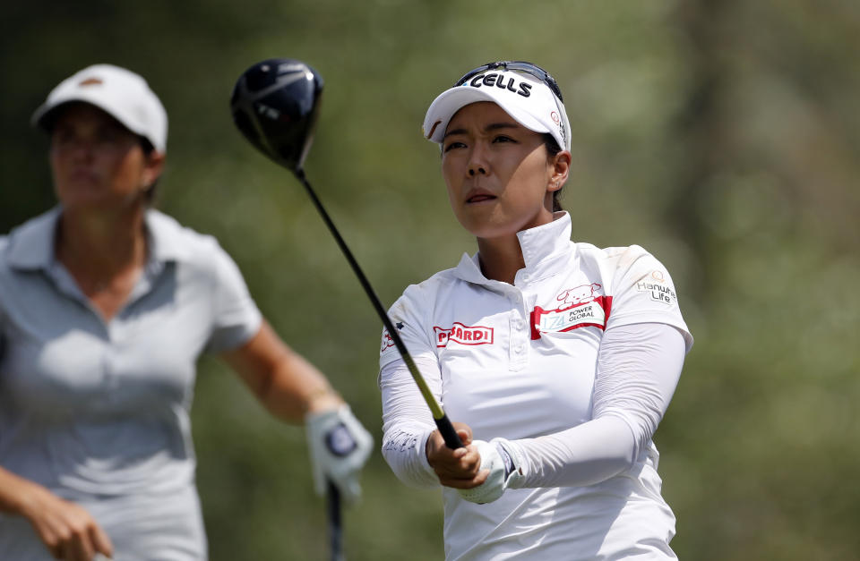 South Korea's Jenny Shin prepares to hit from the second tee during the third round of the Dow Great Lakes Bay Invitational golf tournament, Friday, July 19, 2019, in Midland, Mich. (AP Photo/Carlos Osorio)
