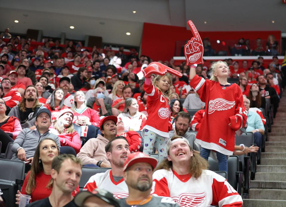 Detroit Red Wings fans cheer during action against the Tampa Bay Lightning in the season opener at Little Caesars Arena in Detroit on Thursday, Oct. 14, 2021.