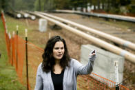 In this Tuesday, Oct. 22, 2019 photo, Carrie Gross speaks during an interview with The Associated Press along the Mariner East pipeline in Exton, Pa. The pipeline route traverses those suburbs, close to schools, ballfields and senior care facilities. "It's absolutely traumatic and I don't say that to exaggerate or cry wolf," said Gross, referring to the project that runs through backyards in her middle-class Philadelphia suburb of Uwchlan Township. "It's devastated my neighborhood." (AP Photo/Matt Rourke)