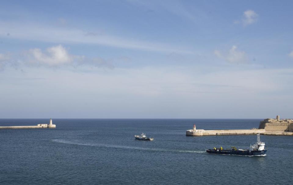Two ships leave the Grand Harbour in Valletta, Malta, on Thursday, Feb. 2, 2017. European heads of state will meet in Malta on Friday for an informal summit to discuss migration and the future of the EU. (AP Photo/Virginia Mayo)