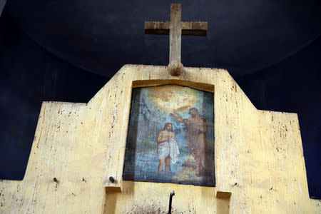 A detail inside a deserted church is seen in an area recently cleared of mines and unexploded ordnance in a project to clear the area near Qasr Al-Yahud, a traditional baptism site along the Jordan River, near Jericho in the occupied West Bank, December 9, 2018. REUTERS/Ammar Awad