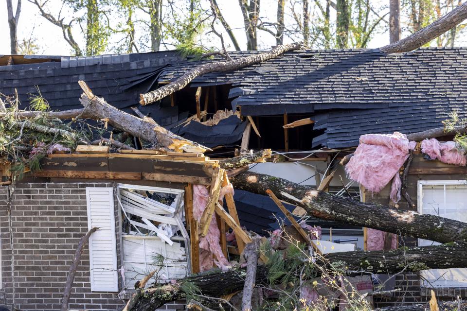 Part of Patti Beeker's house is damaged as a result of severe weather in the area, Wednesday, Nov. 30, 2022, in Eutaw, Ala. She woke her husband Steve just before a tree hit their house. Beeker quipped that she had been looking to renovate her kitchen, but not like this. (AP Photo/Vasha Hunt)