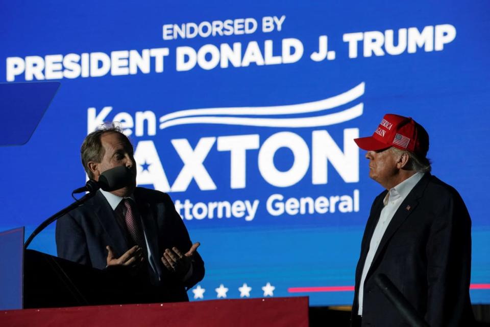 <div class="inline-image__caption"><p>Former U.S. President Donald Trump listens as Texas Attorney General <span class="caas-xray-inline-tooltip"><span class="caas-xray-inline caas-xray-entity caas-xray-pill rapid-nonanchor-lt" data-entity-id="Ken_Paxton" data-ylk="cid:Ken_Paxton;pos:2;elmt:wiki;sec:pill-inline-entity;elm:pill-inline-text;itc:1;cat:Politician;" tabindex="0" aria-haspopup="dialog"><a href="https://search.yahoo.com/search?p=Ken%20Paxton" data-i13n="cid:Ken_Paxton;pos:2;elmt:wiki;sec:pill-inline-entity;elm:pill-inline-text;itc:1;cat:Politician;" tabindex="-1" data-ylk="slk:Ken Paxton;cid:Ken_Paxton;pos:2;elmt:wiki;sec:pill-inline-entity;elm:pill-inline-text;itc:1;cat:Politician;" class="link ">Ken Paxton</a></span></span> speaks during a rally in Robstown, Texas, U.S., October 22, 2022.</p></div> <div class="inline-image__credit">GO NAKAMURA/Reuters</div>