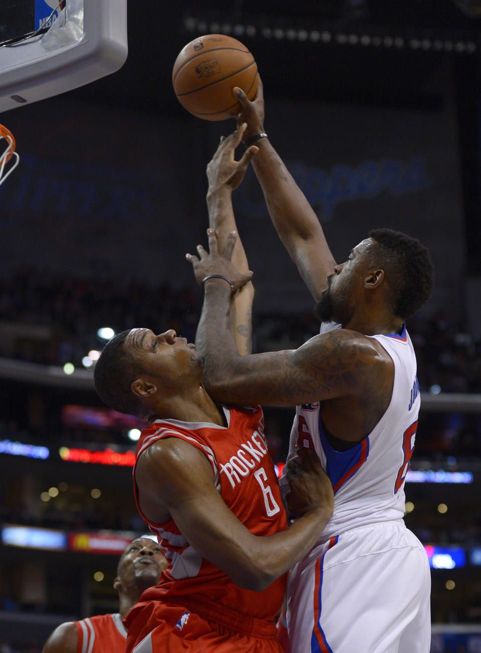 Los Angeles Clippers center DeAndre Jordan, right, puts up a shot as Houston Rockets forward Terrence Jones during the first half of an NBA basketball game, Wednesday, Feb. 26, 2014, in Los Angeles. (AP Photo/Mark J. Terrill)