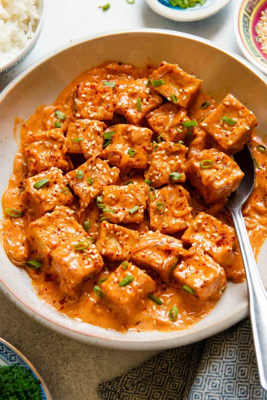 <p>Healthy Nibbles and Bits</p><p>This spicy tofu recipe consists of pan-fried tofu tossed in a rich and flavorful sauce of coconut milk, sambal oelek, and red curry paste. Serve the spicy tofu with jasmine rice and a side of vegetables.</p><p><strong>Get the recipe: <a href="https://healthynibblesandbits.com/spicy-tofu-with-creamy-coconut-sauce/" rel="nofollow noopener" target="_blank" data-ylk="slk:Spicy Tofu with Creamy Coconut Sauce;elm:context_link;itc:0;sec:content-canvas" class="link "><em>Spicy Tofu with Creamy Coconut Sauce</em></a></strong></p>