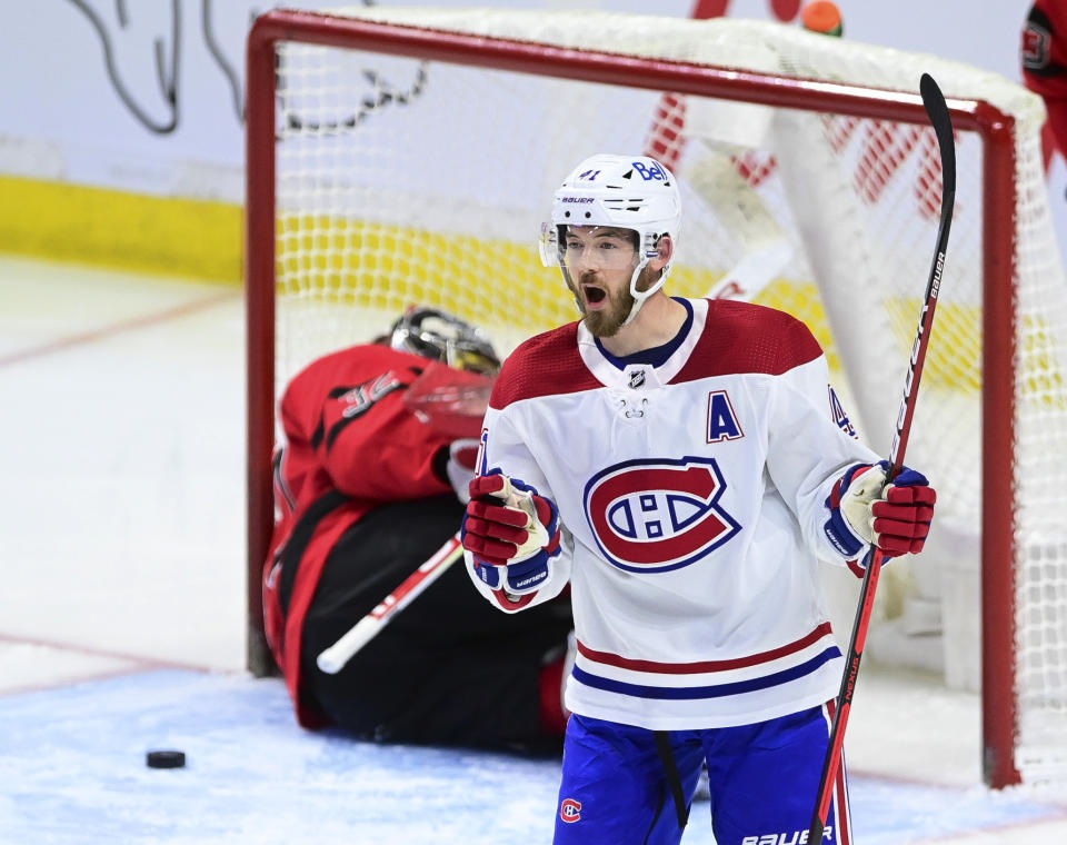 Montreal Canadiens' Paul Byron (41) celebrates a shorthanded goal on Ottawa Senators goalie Filip Gustavsson (32) during the second period of an NHL hockey game Thursday, April 1, 2021, in Ottawa, Ontario. (Sean Kilpatrick/The Canadian Press via AP)