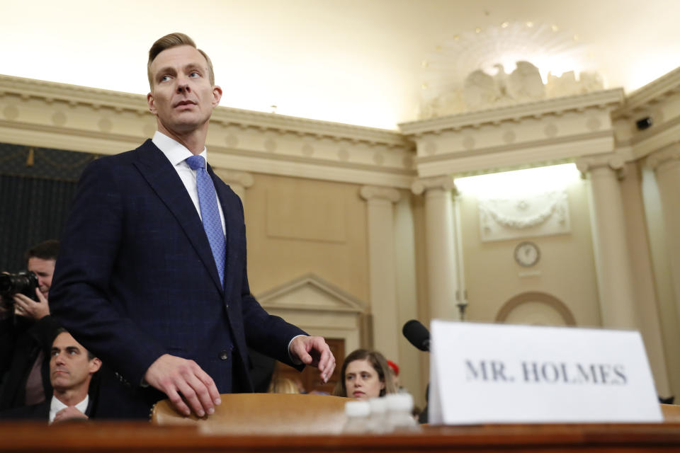 David Holmes, a U.S. diplomat in Ukraine, returns from a break to testify before the House Intelligence Committee on Capitol Hill in Washington, Thursday, Nov. 21, 2019, during a public impeachment hearing of President Donald Trump's efforts to tie U.S. aid for Ukraine to investigations of his political opponents. (AP Photo/Andrew Harnik)