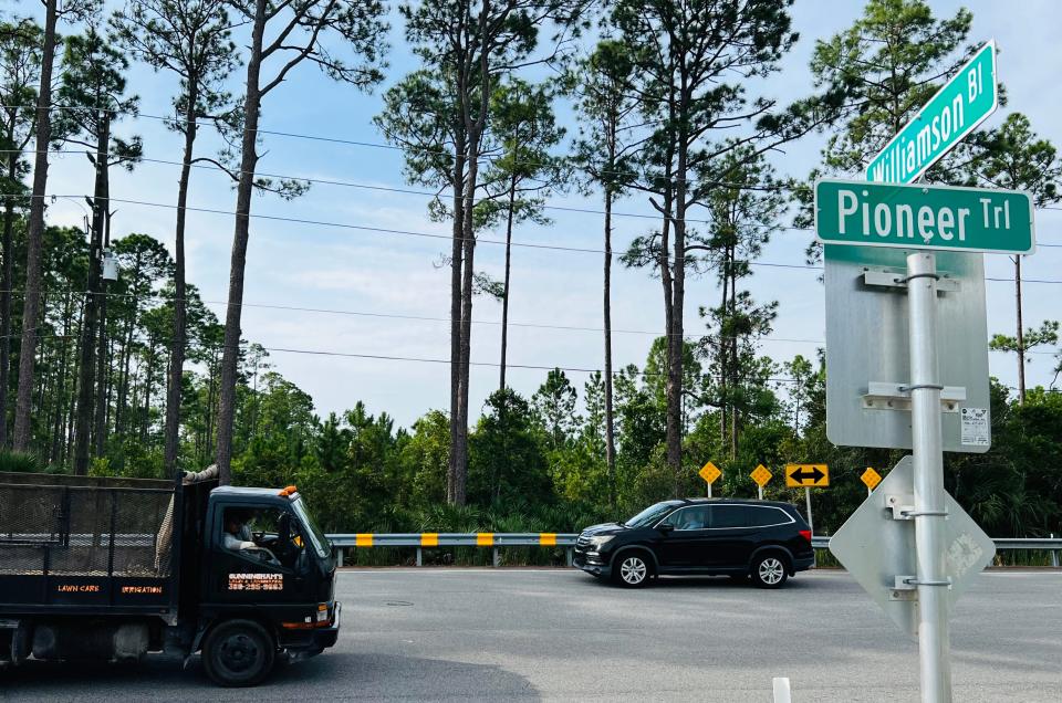 Vehicles pass by the site of the planned 701-home Shell Pointe Colony community along the south side of Pioneer Trail in New Smyrna Beach, Tuesday, Sept. 19, 2023. The future residential subdivision will be just west of Interstate 95, directly south of the already established Woodhaven community.