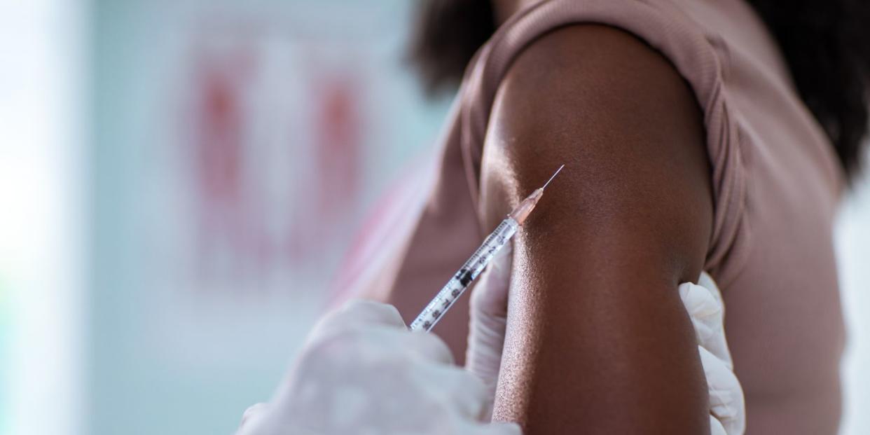 young woman getting vaccinated