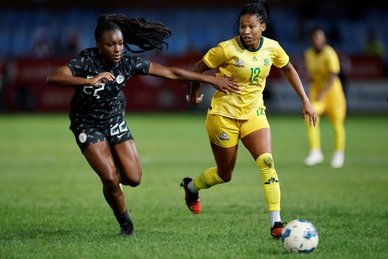 Michele Alozie (L) of <a class="link " href="https://sports.yahoo.com/soccer/teams/nigeria-women/" data-i13n="sec:content-canvas;subsec:anchor_text;elm:context_link" data-ylk="slk:Nigeria;sec:content-canvas;subsec:anchor_text;elm:context_link;itc:0">Nigeria</a> and <a class="link " href="https://sports.yahoo.com/soccer/players/809397/" data-i13n="sec:content-canvas;subsec:anchor_text;elm:context_link" data-ylk="slk:Jermaine Seoposenwe;sec:content-canvas;subsec:anchor_text;elm:context_link;itc:0">Jermaine Seoposenwe</a> of <a class="link " href="https://sports.yahoo.com/soccer/teams/south-africa-women/" data-i13n="sec:content-canvas;subsec:anchor_text;elm:context_link" data-ylk="slk:South Africa;sec:content-canvas;subsec:anchor_text;elm:context_link;itc:0">South Africa</a> in action during a 2024 Olympic Games qualifier (Phill Magakoe)