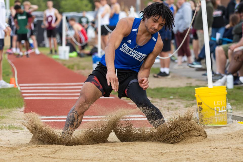 Somersworth's Tayshawn Sheppard wins the triple jump at Friday's Seacoast Track Championship meet at Exeter High School.