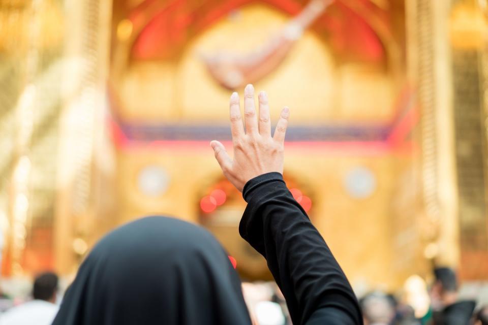 woman praying inside a mosque