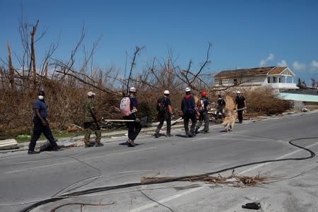 Members of the Canadian Burnaby Firefighters Search & Rescue Task Force search for victims after Hurricane Dorian hit the Abaco Islands in Marsh Harbour