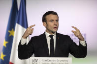 French President Emmanuel Macron, delivers a speech during a press conference a part of his visit in Mulhouse, eastern France, Tuesday, Feb. 18, 2020. Macron said Tuesday he was determined to fight against "Islamist separatism" but also "discrimination ». (AP Photo/Jean-Francois Badias, Pool)