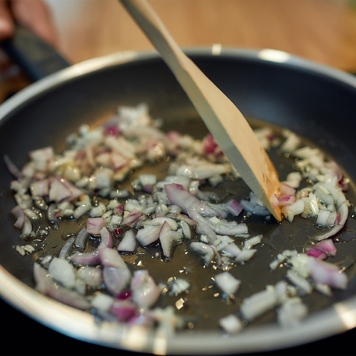 red onions sauteeing in oil