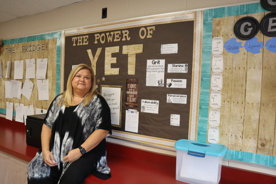 Amber McCoy a fourth grade teacher, poses at Kellogg Elementary School in Huntington, W.Va. on October 17, 2022. McCoy, a union member, opposes a proposed constitutional amendment on the ballot this November that would give the legislature ultimate control over education policy decisions in West Virginia. (AP Photo/Leah Willingham)