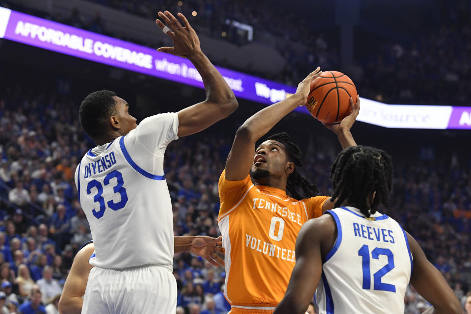 Tennessee forward Jonas Aidoo (0) attempts a shot over Kentucky forward Ugonna Onyenso (33) during the first half of an NCAA college basketball game in Lexington, Ky., Saturday, Feb. 3, 2024. (AP Photo/Timothy D. Easley)