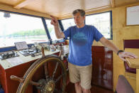 Danny Collier gestures as he speaks aboard his boat, the Princess Freda on the river Thames in London, Friday, May 8, 2020. Danny and his brother John Collier are the proud owners of the boats the Princess Freda, the Queen Elizabeth, the Connaught and the Clifton Castle. All four boats have had their moment in the sun. And all four were meant to have another on Friday as Britain celebrates the 75-year anniversary of Victory in Europe Day. Instead, they're lying idle on the banks of the River Thames, not far from Kew Gardens in southwest London, as the festivities surrounding VE Day have been all but cancelled as a result of the coronavirus pandemic. For the brothers it’s nothing less than a disaster, one that could spell the demise of the company their late father created in 1975. (AP Photo/Vudi Xhymshiti)