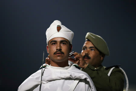 An Honour Guard prepares for the arrival of Britain's Prince Harry and Meghan, Duchess of Sussex, at the Casablanca Airport in Casablanca, Morocco February 23, 2019. REUTERS/Hannah McKay/Pool