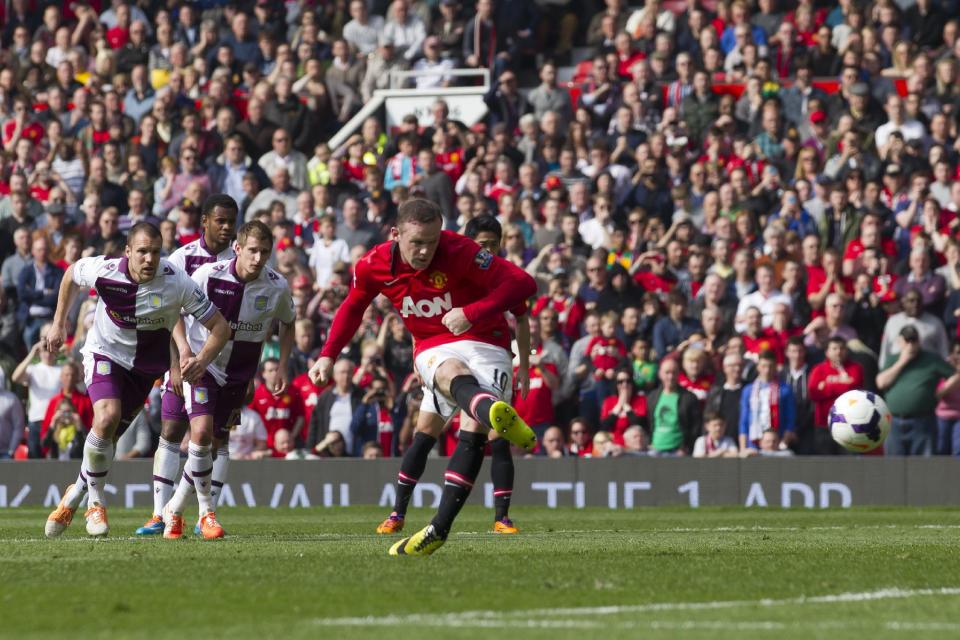 Manchester United's Wayne Rooney scores a penalty against Aston Villa, during their English Premier League soccer match at Old Trafford Stadium, Manchester, England, Saturday March 29, 2014. (AP Photo/Jon Super)