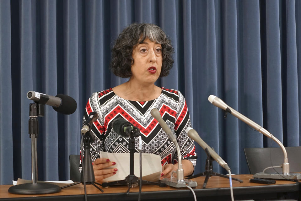 Rochelle Kopp, a long-time Tokyo resident and a leader of a widening movement opposing a controversial redevelopment for a historic park, talks to reporters at the Education Ministry Monday, Sept. 25, 2023. Kopp submitted a fresh petition Monday, urging the Education Ministry to intervene and have one of its agencies involved as a landowner to revise the plan so that it won't cause overdevelopment and save more trees.(AP Photo/Mari Yamaguchi)