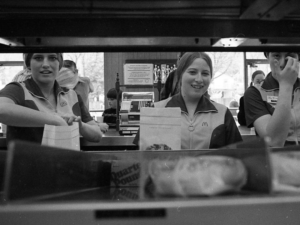 Workers at a McDonald's bag hamburgers in 1973