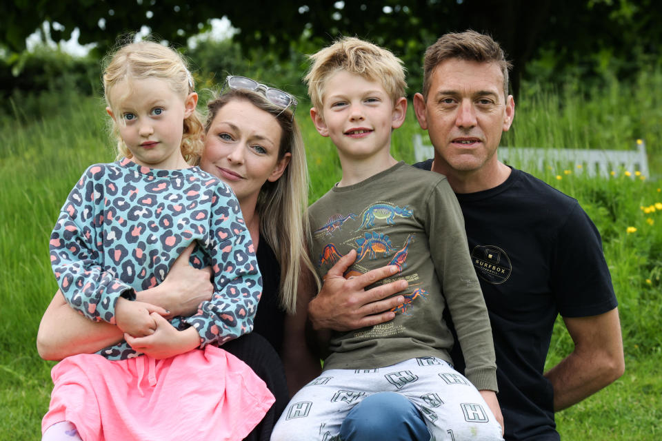 Rob Chislett with his wife Corin and their children. NB children's names withheld. See SWNS story SWPLgunfire. This is the moment a mum confronts armed police on a firing range next to her home - which the family discovered didn't even have planning permission. Corin Chislett, 34, was able to wander up to cops wielding massive guns - demanding they stop. Corin, 34, and husband Rob, 48, are in the middle of Britain's most explosive neighbour dispute - with local armed officers. Rob and Corin say their children are afraid to go outside as cops fired high-calibre guns up to four times a week - without a permit.  