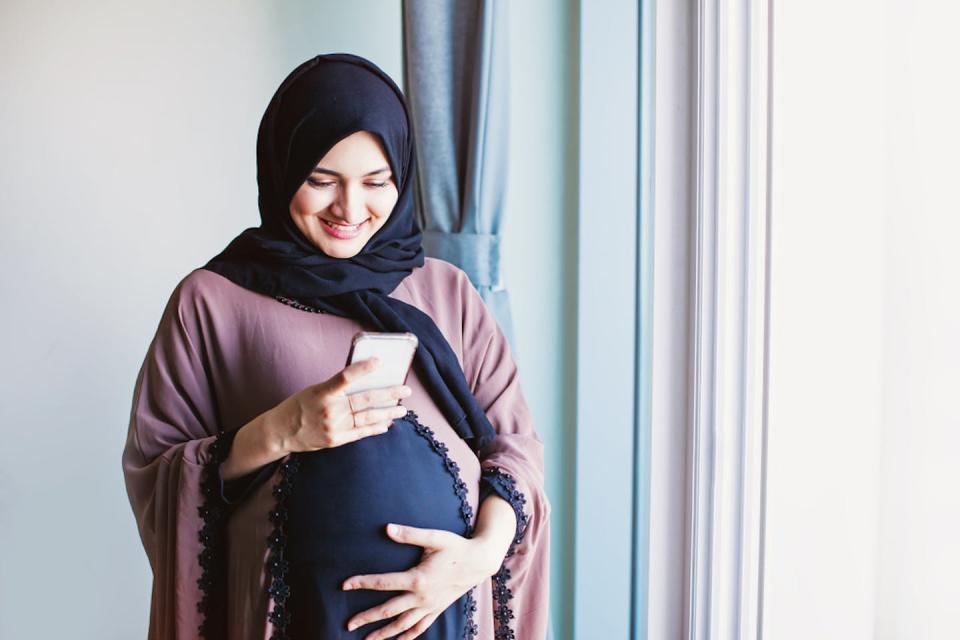 Some candidate RSV vaccines are given to pregnant women to protect their babies. <a href="https://www.shutterstock.com/image-photo/young-pregnant-arab-woman-hijab-using-1407599552" rel="nofollow noopener" target="_blank" data-ylk="slk:Shutterstock;elm:context_link;itc:0;sec:content-canvas" class="link ">Shutterstock</a>