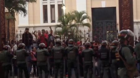 Officials shout at the National Assembly as the Venezuelan National Guard stands by in Caracas, June 27, 2017, in this still image taken from a video obtained from social media. Social Media/Gabriela Gonzalez @GabyGabyGG/via REUTERS