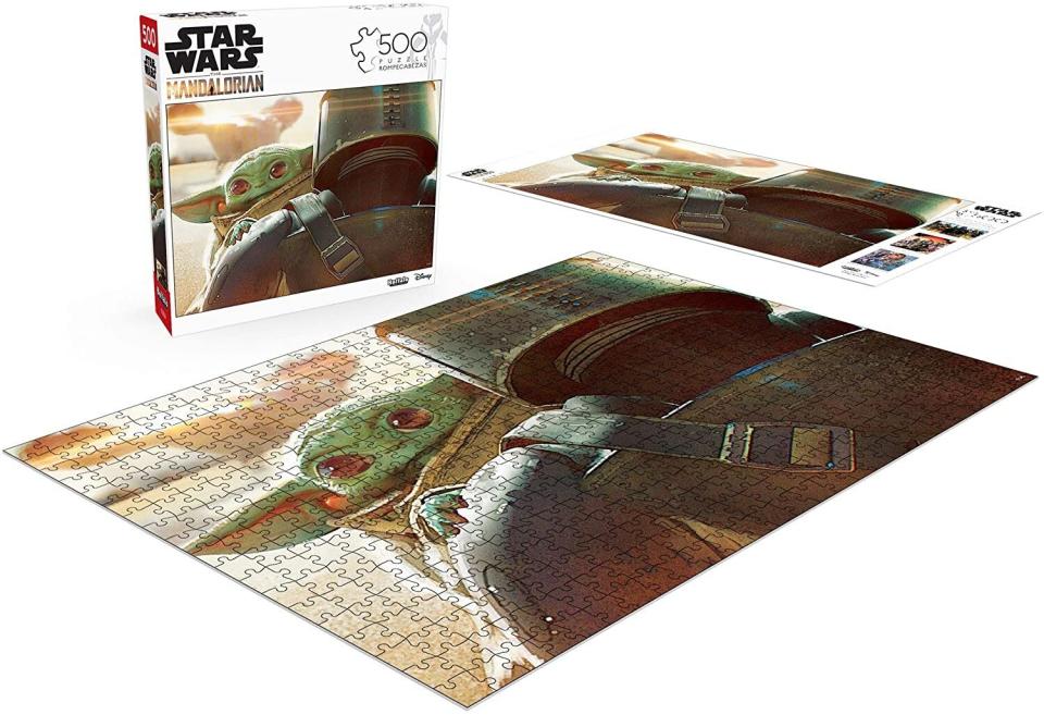 If they're a fan of "The Mandalorian," they'll probably be a fan of <a href="https://amzn.to/2ZXsIr1" target="_blank" rel="noopener noreferrer">this jigsaw puzzle</a> featuring the title character<i> and </i>Baby Yoda. <a href="https://amzn.to/2ZXsIr1" target="_blank" rel="noopener noreferrer">Find it for $10 at Amazon</a>.