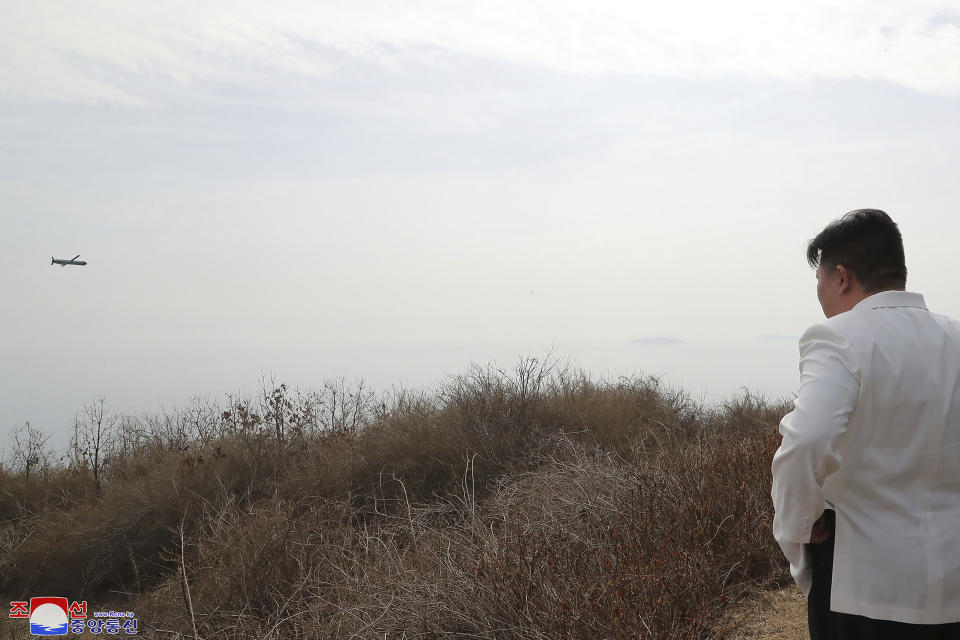 In this photo provided by the North Korean government, North Korean leader Kim Jong Un inspects what it says a test launch of a Hwasal strategic cruise missile during an exercise in North Korea Wednesday, March 22, 2023. Independent journalists were not given access to cover the event depicted in this image distributed by the North Korean government. The content of this image is as provided and cannot be independently verified. Korean language watermark on image as provided by source reads: "KCNA" which is the abbreviation for Korean Central News Agency. (Korean Central News Agency/Korea News Service via AP)