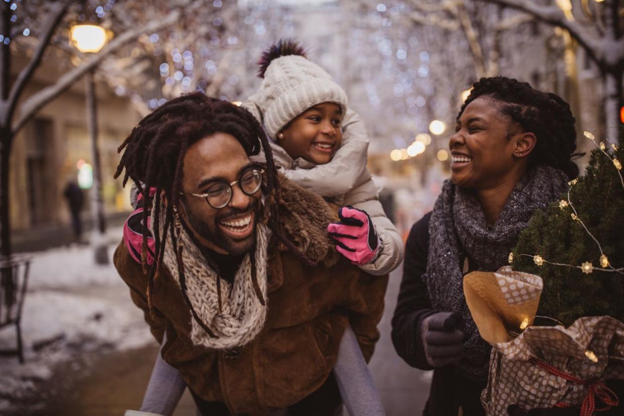 Young family preparing for Christmas holiday