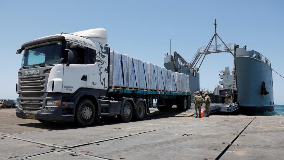 PHOTO: A truck carries humanitarian aid across Trident Pier, a temporary pier to deliver aid, off the Gaza Strip, amid the ongoing conflict between Israel and Hamas, near the Gaza coast, June 25, 2024. (Amir Cohen/Reuters)