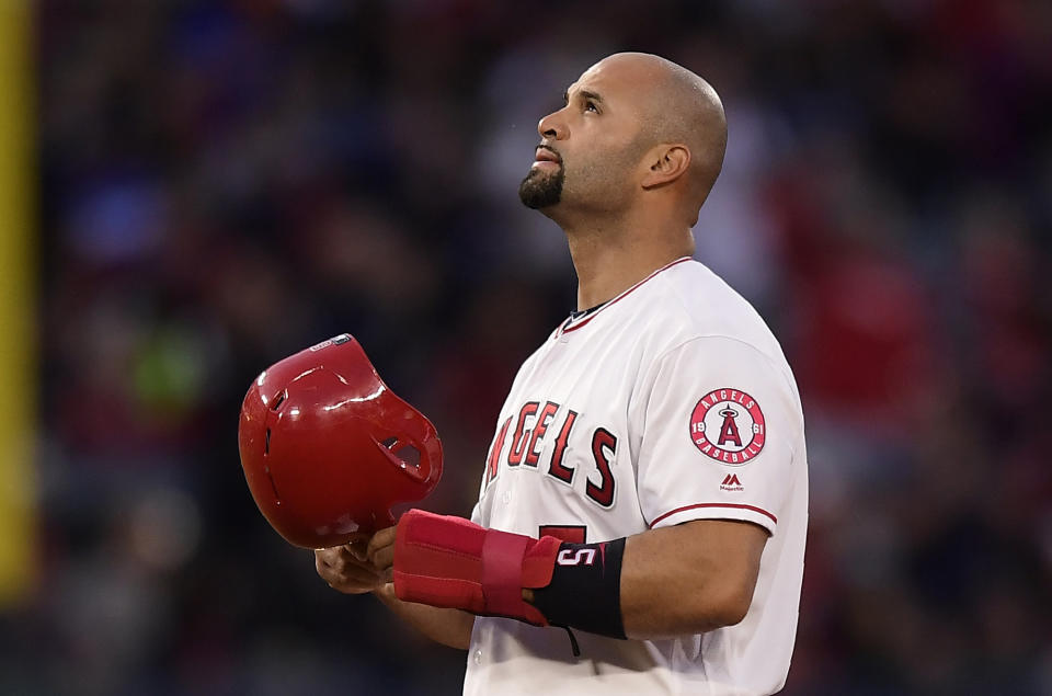 Los Angeles Angels' Albert Pujols looks toward the sky after hitting an RBI double during the third inning of a baseball game against the Seattle Mariners Saturday, April 20, 2019, in Anaheim, Calif. With that RBI, Pujols tied Babe Ruth for 5th place on the all-time RBI list with 1,992. (AP Photo/Mark J. Terrill)