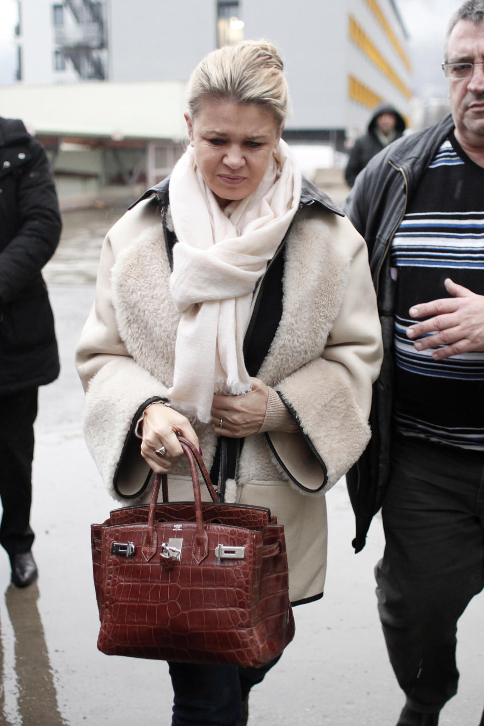 Michael Schumacher's wife, Corinna arrives at the Grenoble hospital, French Alps, Friday, Jan. 3, 2014, where former seven-time Formula One champion Michael Schumacher is being treated after sustaining a head injury during a ski accident. Schumacher's condition is reported to be stable but still critical as he remained unconscious, his manager said Wednesday. (AP Photo/Thibault Camus)