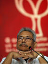 Sri Lankan presidential candidate and former defense chief Gotabaya Rajapaksa sits during a news conference in Colombo, Sri Lanka, Tuesday, Oct. 15, 2019. Rajapaksa, who's a front-runner in next month's presidential election says if he wins he won't recognize an agreement the government made with the U.N. human rights council to investigate alleged war crimes during the nation's civil war. (AP Photo/Eranga Jayawardena)