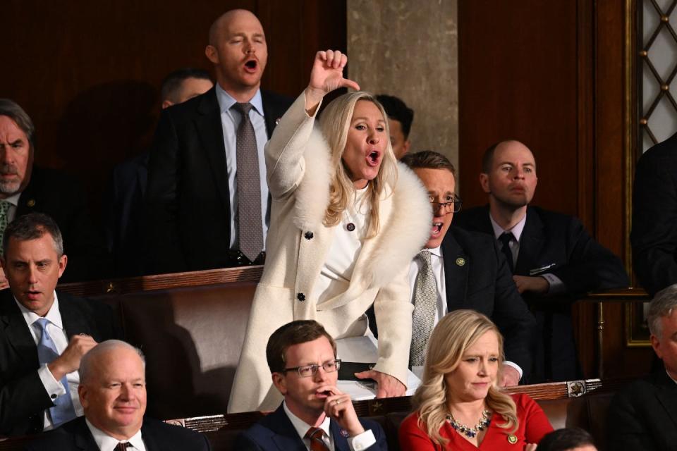 U.S. Rep. Marjorie Taylor Greene and other Republican members of Congress react during President Joe Biden’s 2023 State of the Union address. <a href="https://www.gettyimages.com/detail/news-photo/representative-marjorie-taylor-greene-and-republican-news-photo/1246876969?adppopup=true" rel="nofollow noopener" target="_blank" data-ylk="slk:Jim Watson/AFP via Getty Images;elm:context_link;itc:0;sec:content-canvas" class="link ">Jim Watson/AFP via Getty Images</a>