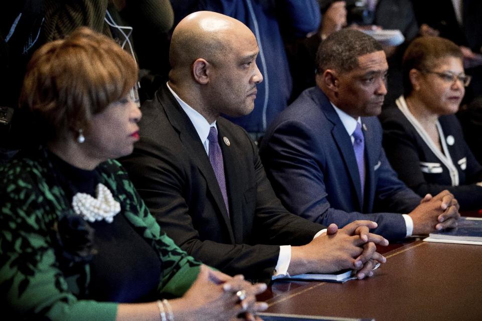 From left, Rep. Brenda Lawrence, D-Mich., Rep. Andre Carson, D-Ind., Congressional Black Caucus Chairman Rep. Cedric Richmond, D-La., Rep. Karen Bass, D-Calif., and other members of the Congressional Black Caucus meet with President Donald Trump in the Cabinet Room of the White House in Washington, Wednesday, March 22, 2017. (AP Photo/Andrew Harnik)