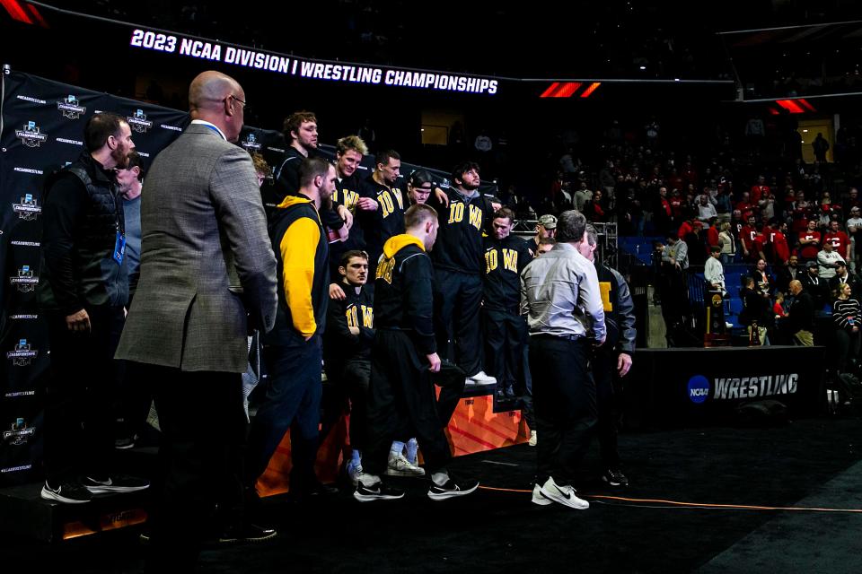 Iowa Hawkeyes wrestlers walk off the podium with their second place trophy in the finals during the sixth session of the NCAA Division I Wrestling Championships, Saturday, March 18, 2023, at BOK Center in Tulsa, Okla.