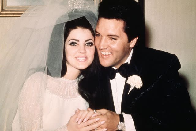 <p>Bettmann</p> Elvis Presley and Priscilla Ann Beaulieu following their wedding on May 1, 1967.