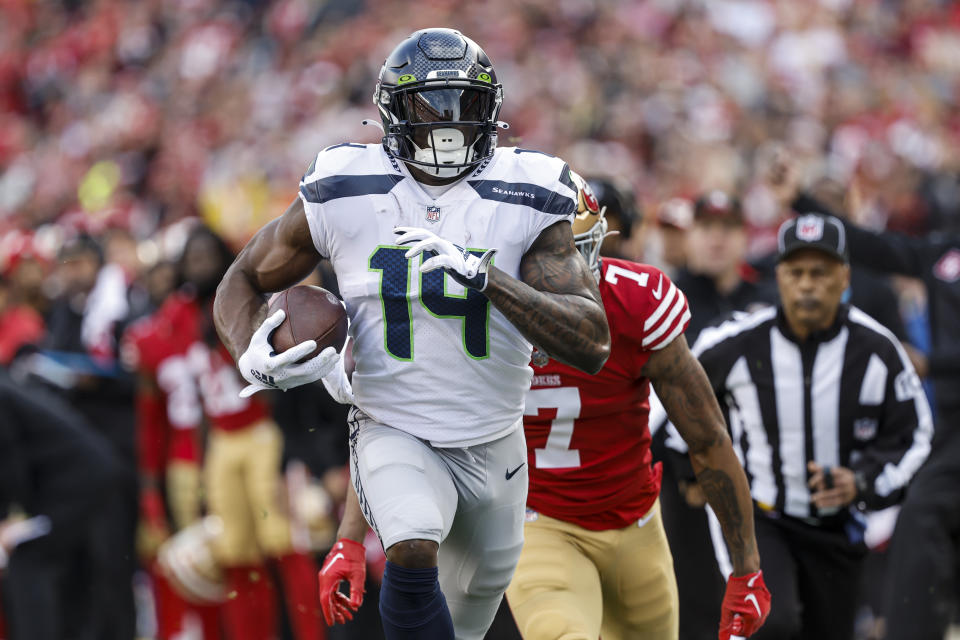 Seattle Seahawks wide receiver DK Metcalf (14) runs toward the end zone to score in front of San Francisco 49ers cornerback Charvarius Ward during the first half of an NFL wild card playoff football game in Santa Clara, Calif., Saturday, Jan. 14, 2023. (AP Photo/Josie Lepe)