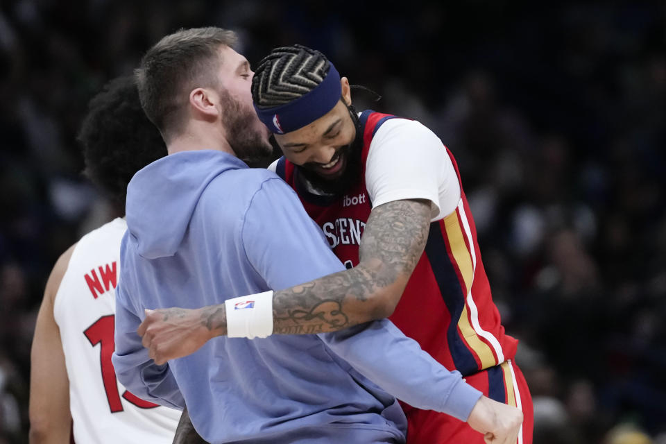 New Orleans Pelicans forward Brandon Ingram (14) hugs forward Matt Ryan as he walks to the bench after making back-to-back 3-point shots in the second half of an NBA basketball game against the Toronto Raptors in New Orleans, Monday, Feb. 5, 2024. Ingram had a career high eight 3-pointers and a season high 41 points, as the Pelicans won 138-100. (AP Photo/Gerald Herbert)